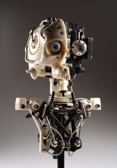 MINIATURE ROBOTIC CYBORG SKULL TITLED CYNTHETIC HALF BY ARTIST CHRISTOPHER CONTE