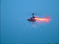 Gas Powered Radio Control Helicopter modified to remotely fire model rockets by Christopher Conte