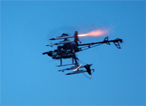 Gas Powered Radio Control Helicopter modified to remotely fire model rockets by Christopher Conte